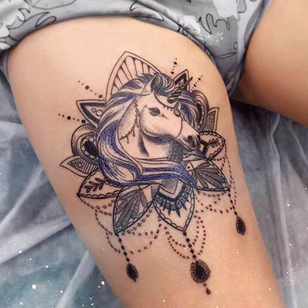Female Tattoo on the Thigh