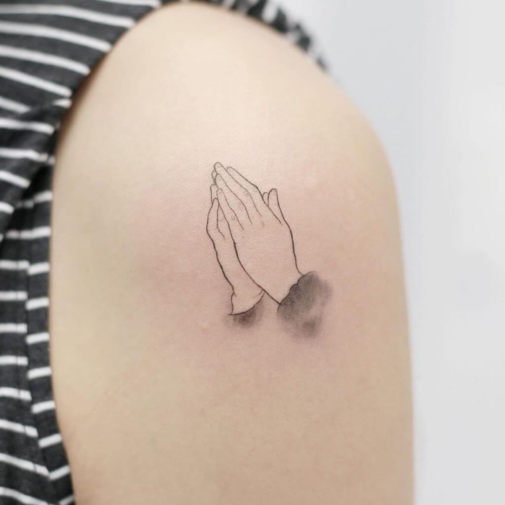 praying hands tattoo mean