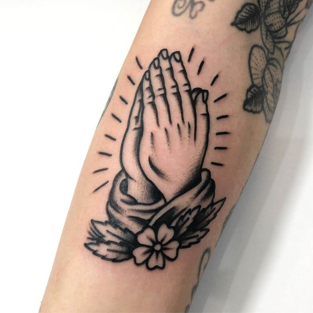 praying hands tattoo mean