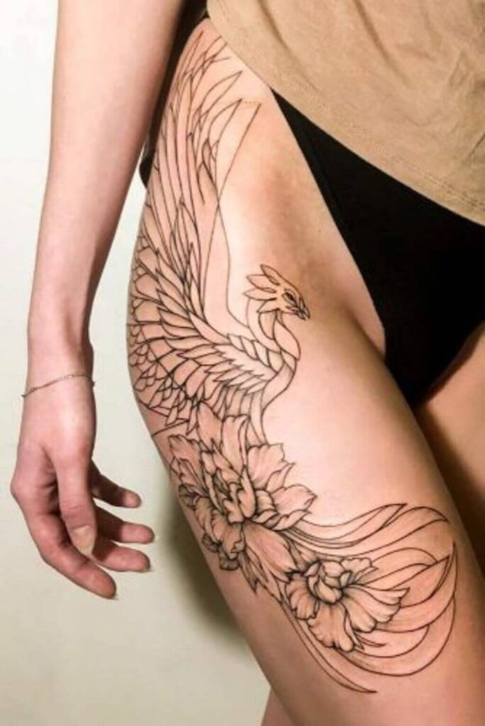 Tattoo of a Phoenix on the thigh