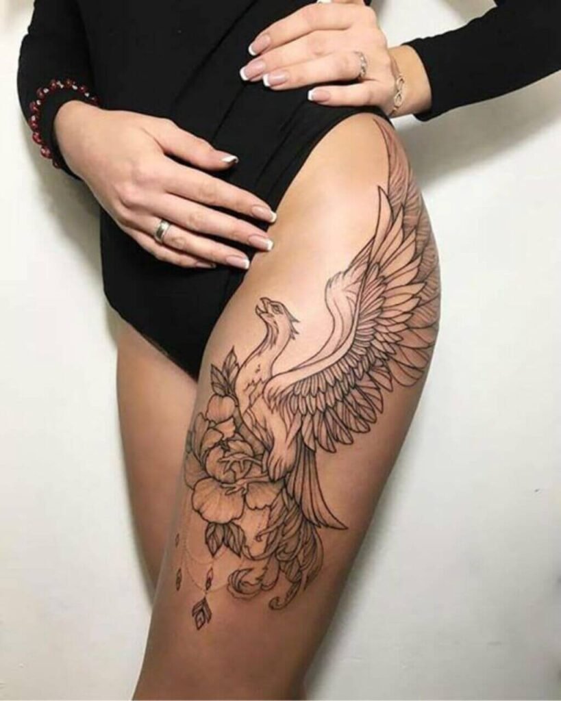 Tattoo of a geometric phoenix bird on the waist