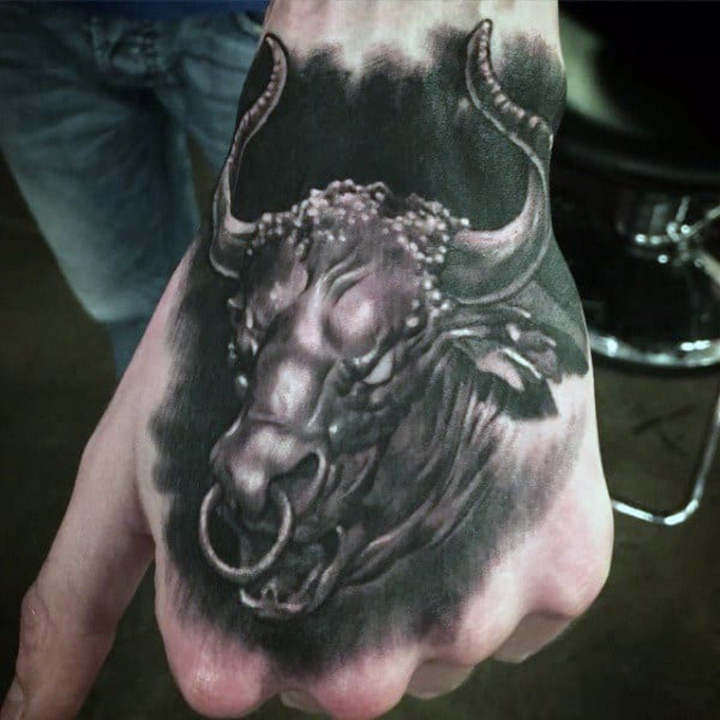 Color Tattoo of a Bull That Looks Real on a Man's Hand
