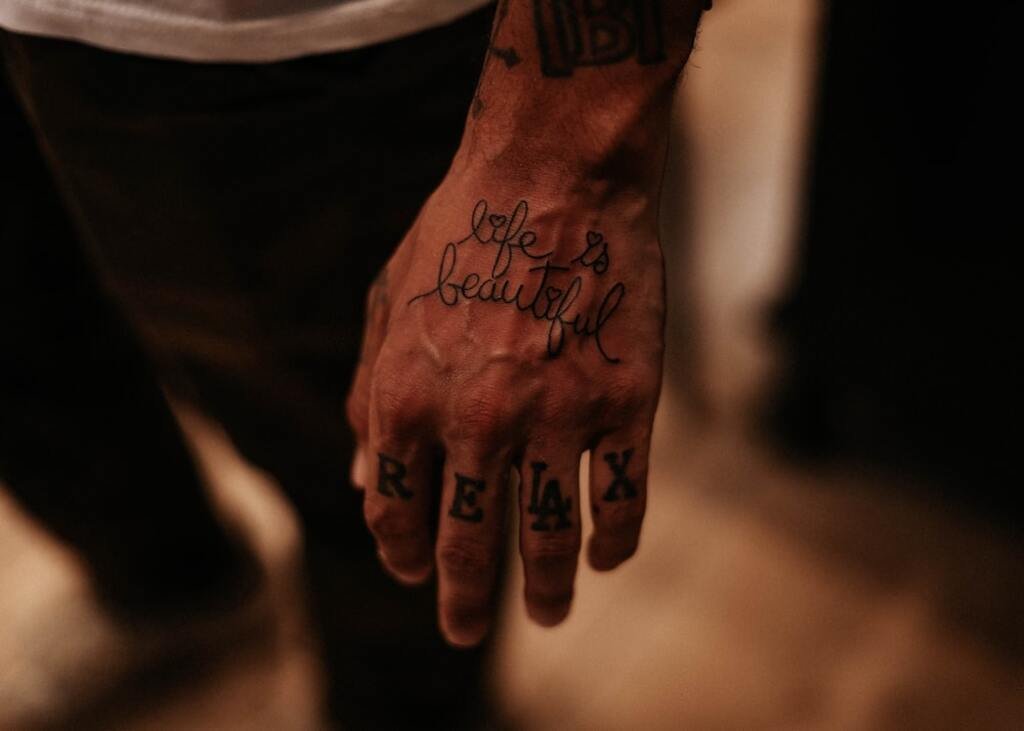 Hand Tattoos for Men That Say "Life Is Beautiful"